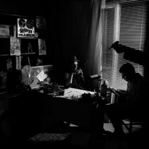 Cinematic black and white classroom portrait with natural sunlight and high contrast tones